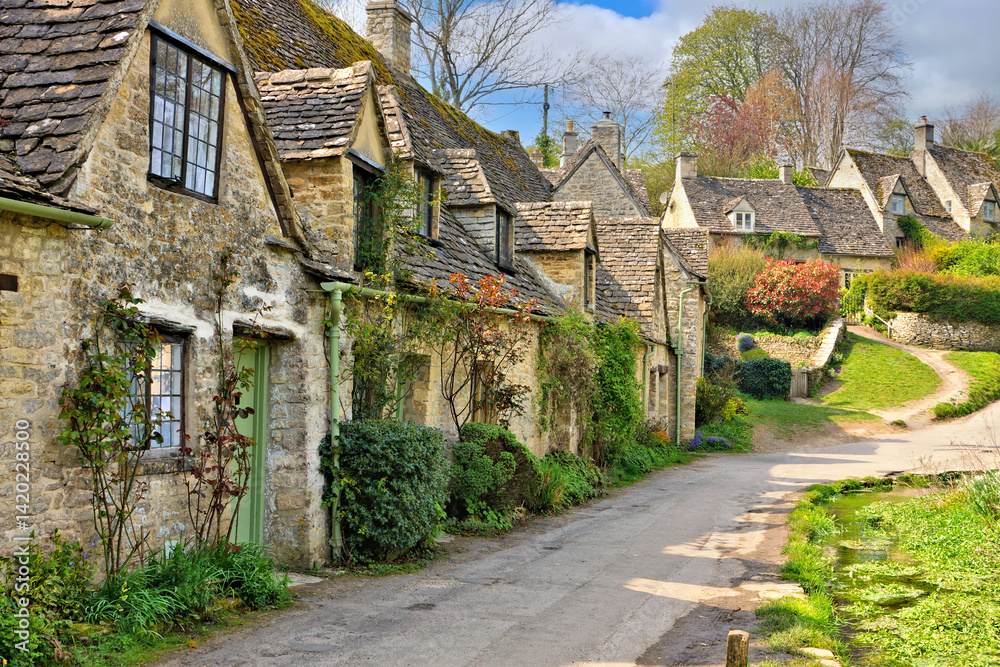 Idyllic Arlington Row of the village of Bibury in the English Cotswolds during spring, Gloucestershire, England, UK Idyllic Arlington Row of the village of Bibury in the English Cotswolds during spring, Gloucestershire, England, UK