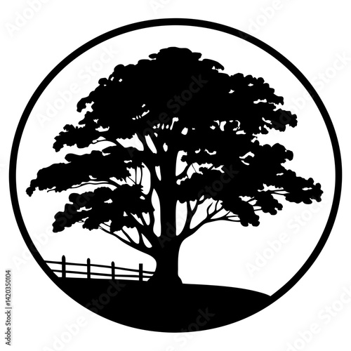 Silhouette of a majestic tree within a circle, with a picket fence