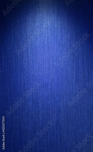 close-up photograph of blue wood panel with light beam from above, abstract grain texture, suitable for use as a rustic background or a surface in design projects.