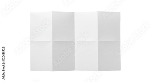 A white sheet of paper folded into eight sections against a black background in a studio shot