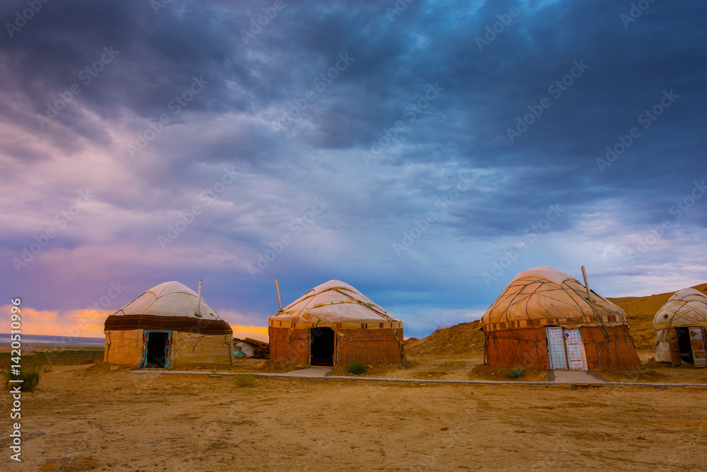 Nomadic Yurt tent camp in the desert of the Aral Lake at sunset, Uzbekistan