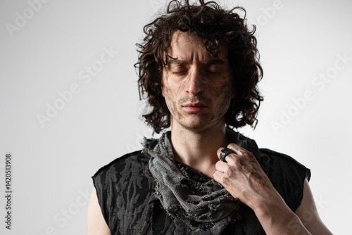 A curly-haired guy in a grunge outfit, a dramatic portrait of a Shakespearean character in a modern way