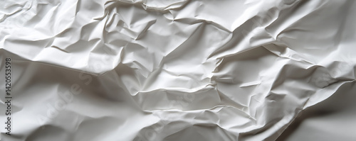 Crumpled white paper creates an abstract textured background