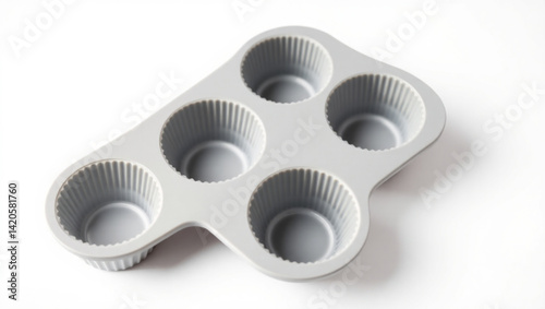 Overhead view of a gray six cup muffin tin with paper liners on a white surface in a studio setting created with generated ai