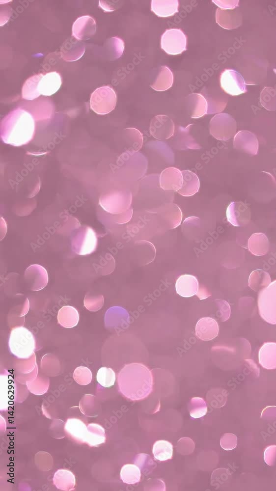 Soft pink bokeh background with sparkling droplets
