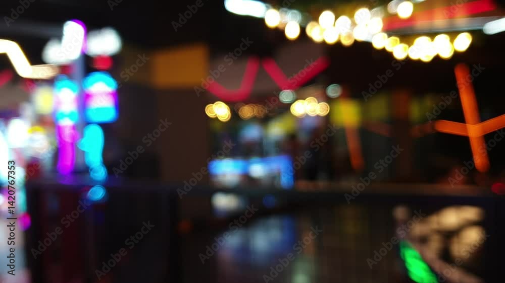 Blurred video of a vibrant indoor play area with colorful lights and dynamic atmosphere perfect for use as a background or overlay in family, entertainment, or lifestyle-themed creative projects