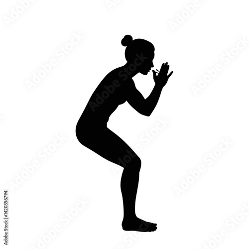Silhouette of a woman practicing yoga in a squat position  