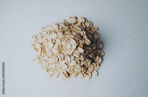 Pile of Rolled Oats on a Light Background photo
