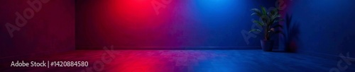 A minimalistic space featuring blue and red lighting with a plant accent.