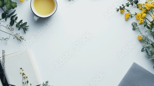 Cozy Workspace with Tea, Notebook, and Fresh Seasonal Flowers