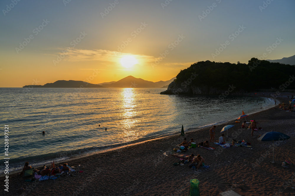 Sunset over Milocer beach near Budva along the coast of the Adriatic Sea in Montenegro
