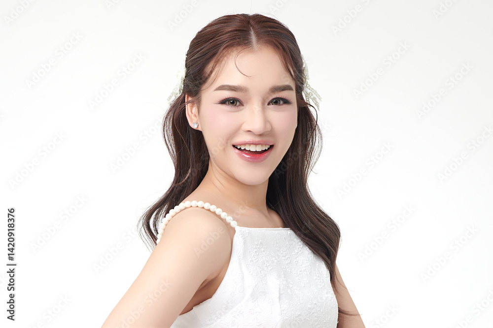 A beautiful young Asian woman with clean, fresh skin against a white background. Skincare, facial treatment, cosmetology, beauty, and spa. An elegant portrait of an Asian woman. A beautiful young Asian woman with clean, fresh skin against a white background. Skincare, facial treatment, cosmetology, beauty, and spa. An elegant portrait of an Asian woman.