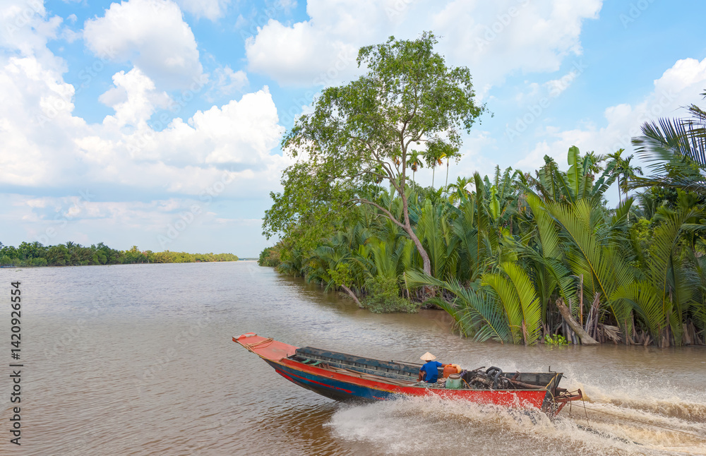 Fisherman is fishing in Mekong river in the morning - People boating in the delta of Mekong river, Vietnam, Asia