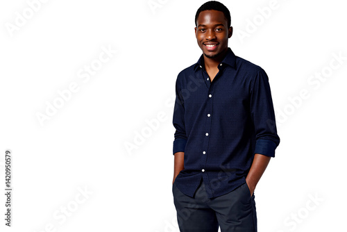 Confident young Black man smiling warmly and looking directly at the camera, dressed smartly in a dark navy blue long-sleeve button-down shirt and dark trousers, hands casually placed in pockets