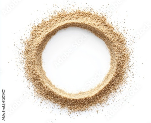 Circular frame of light brown granular powder.  A circle of loose, fine powder, creating a textured border on a white background. The powder appears dry and uniform in color