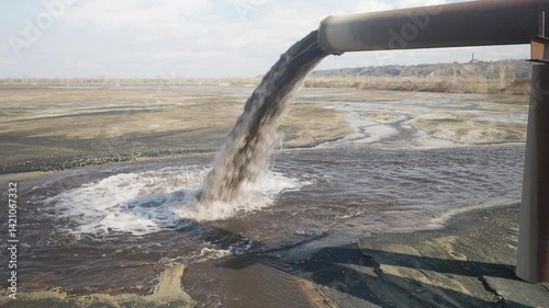 Dirty sewage pollutes the environment. Powerful waste stream from the pipe.
