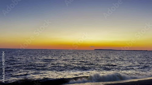 Sunset Sky with Clouds Reflected on Water Surface