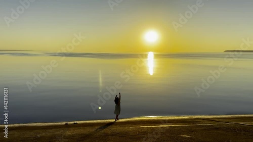Sunset Sky with Clouds Reflected on Water Surface