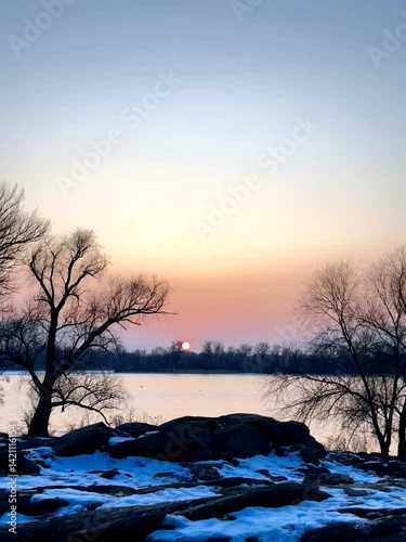 Sunset Sky with Clouds Reflected on Water Surface