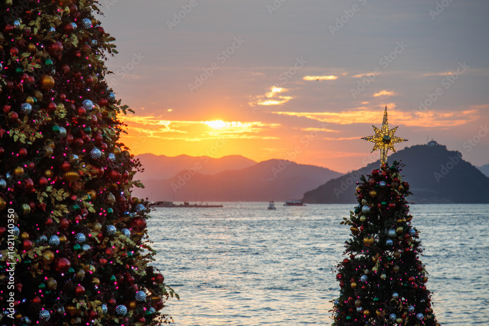 Seaside Christmas Trees at Sunset with Mountain Silhouette