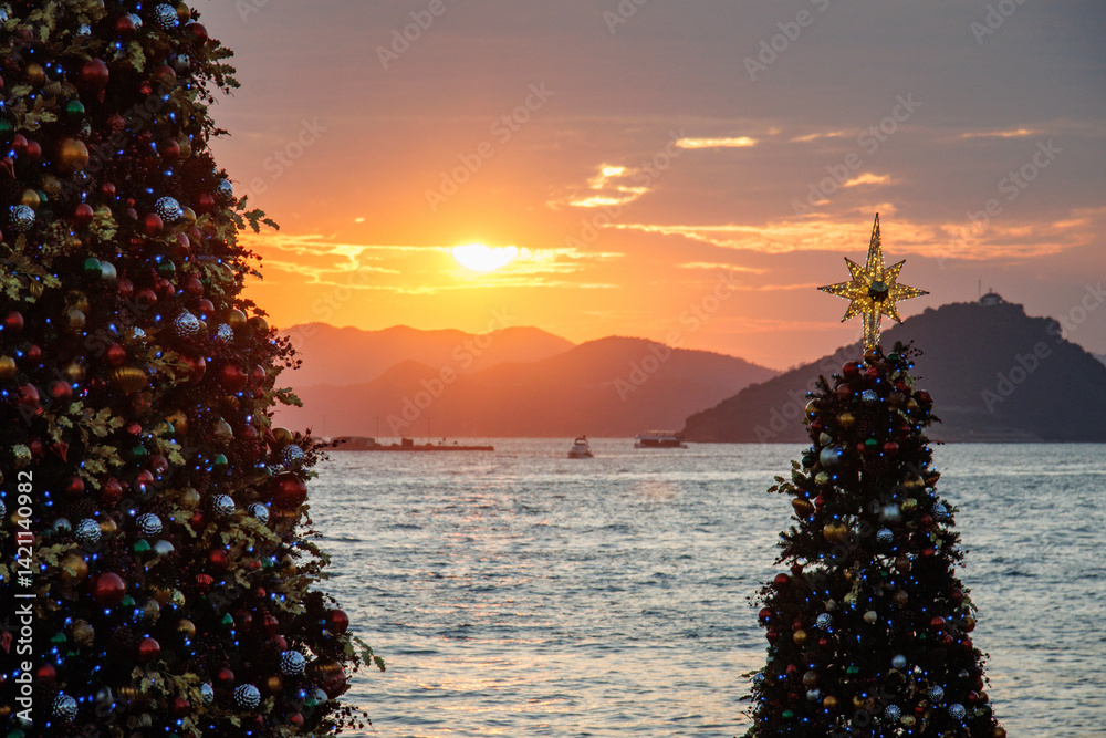 Seaside Christmas Trees at Sunset with Mountain Silhouette