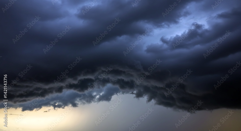 Dark, menacing storm clouds roll in as evening descends, signaling a brewing storm that casts shadows over the landscape. The air feels charged with anticipation and impending rain Dark, menacing storm clouds roll in as evening descends, signaling a brewing storm that casts shadows over the landscape. The air feels charged with anticipation and impending rain