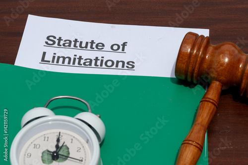 Legal Time Limit Display: Statute of Limitation Paper with Gavel on Desk
