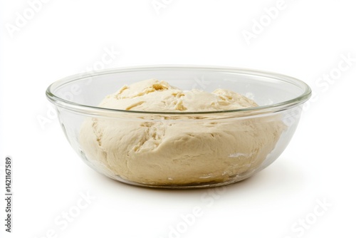 Glass bowl with dough placed on clean white background