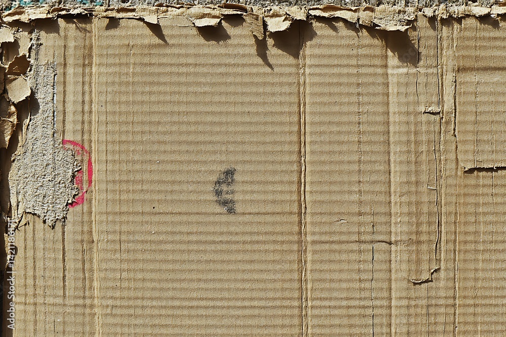 Textured Cardboard Surface with Brown Tones Showing Damage and Peeling