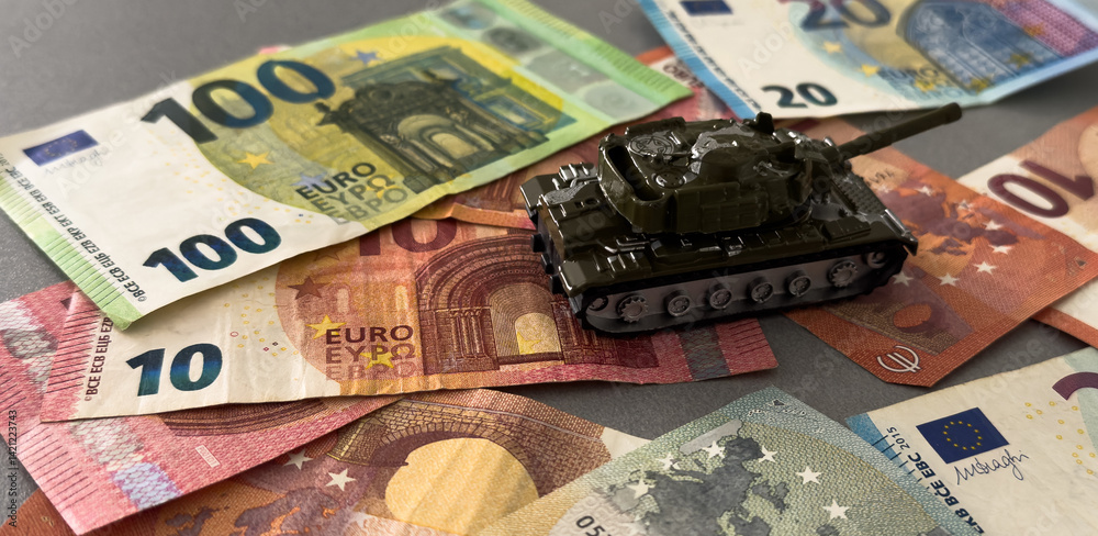 Tank on background of banknotes. Currency war. War costs, military spending. Making money from war. Money laundering on War. Military economy. Military tank and European banknotes. Weapons trade.