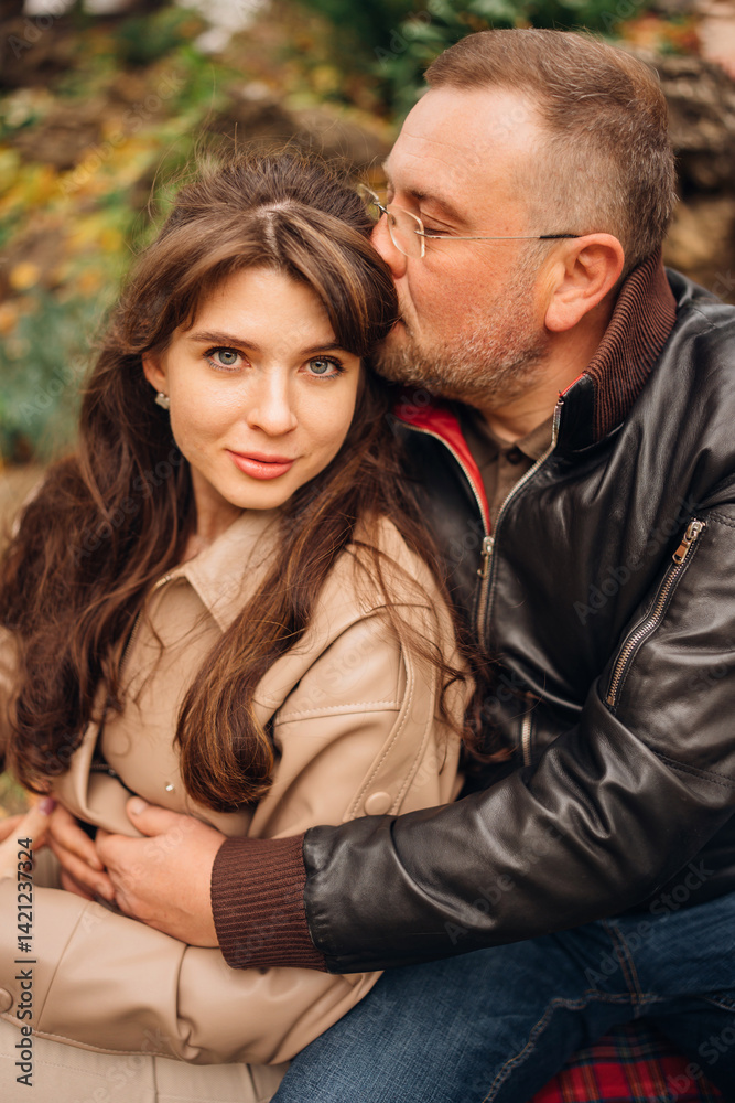 Couple enjoying a cozy moment outdoors in a natural setting