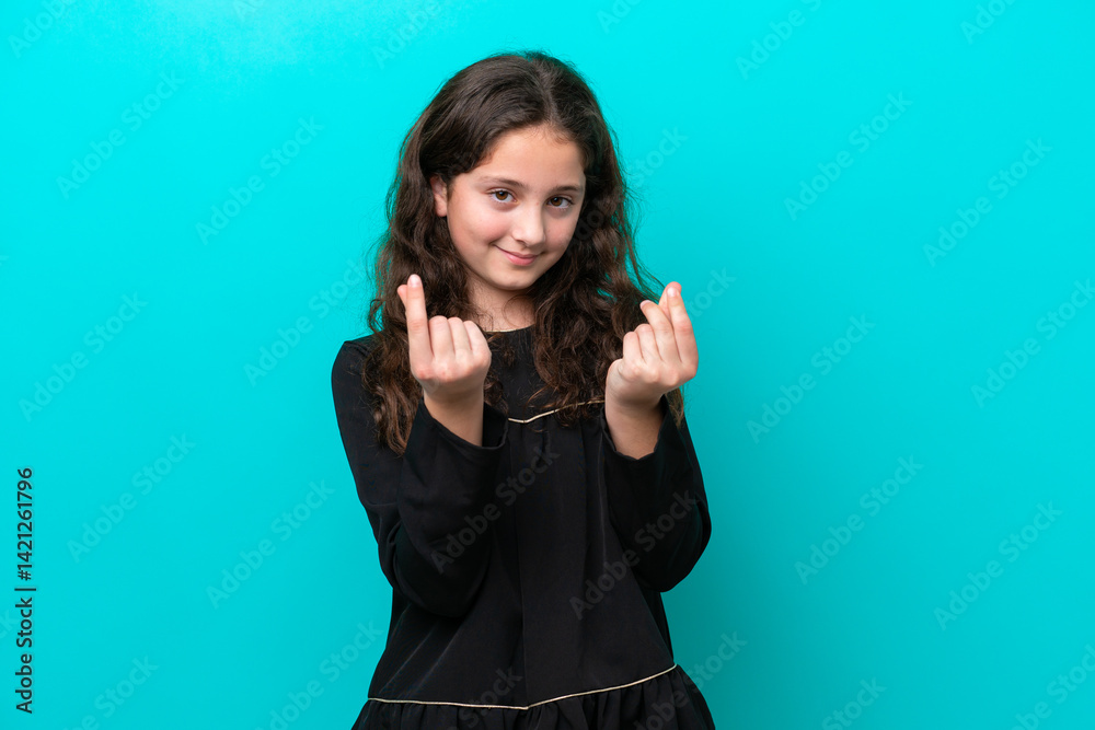 Fototapeta premium Little girl isolated on blue background making money gesture