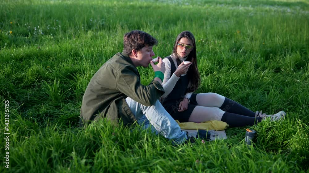 A Casual Moment of Young People Enjoying Tasty Snacks While Connecting in the Great Outdoors A Casual Moment of Young People Enjoying Tasty Snacks While Connecting in the Great Outdoors