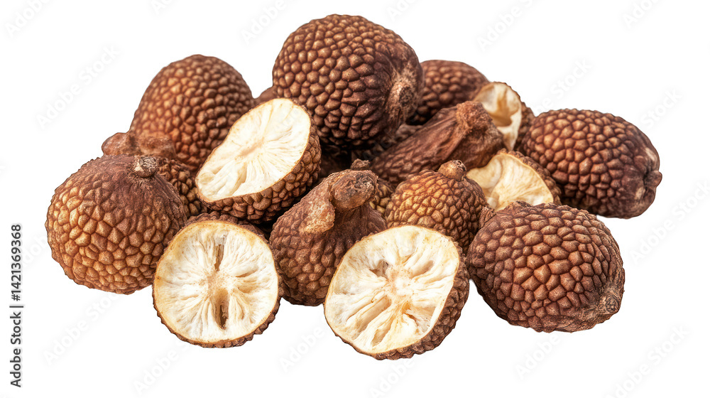 A collection of dried rambutan fruits, some whole, and others halved, showing the white flesh and pit inside.