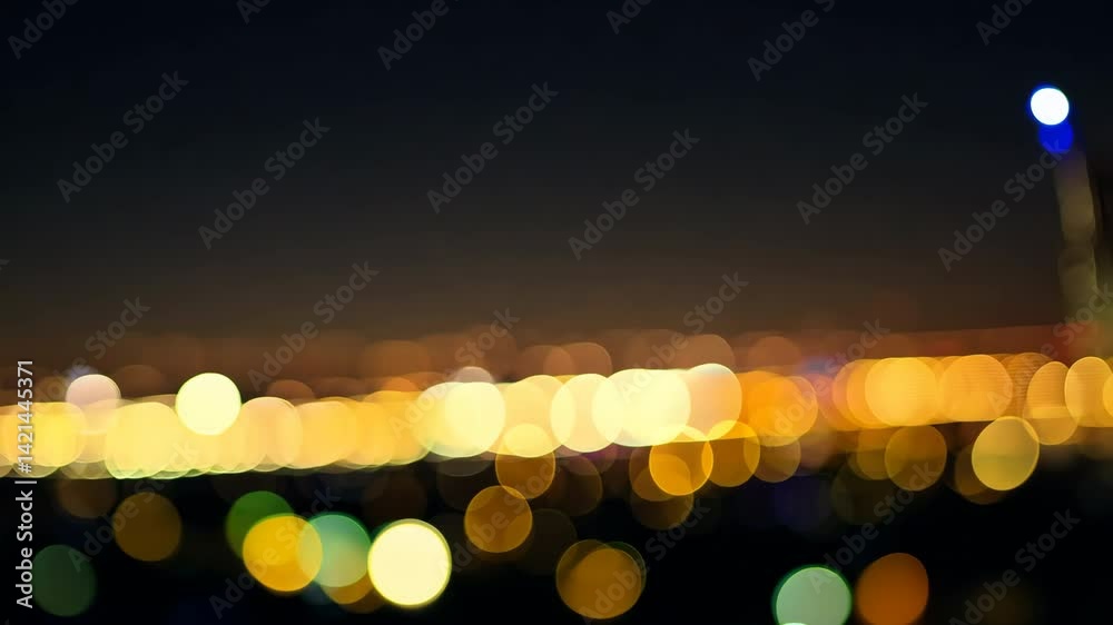 Blurred city lights bokeh shine with the bright glow of holiday candles in the dark night