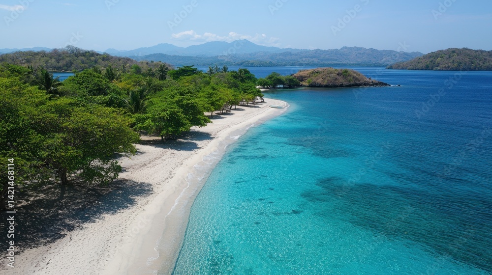 Clear blue water meets sandy beach and lush greenery in a tropical paradise setting Clear blue water meets sandy beach and lush greenery in a tropical paradise setting
