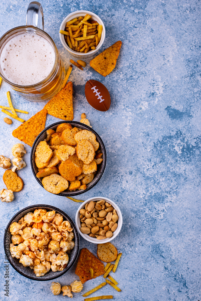 Fototapeta premium Beer and different snacks for Superbowl or football party