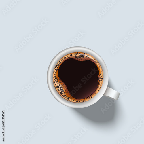A top view of hot black coffee drink in a white ceramic cup on a light background.