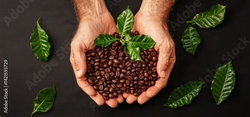 Man holding a handful of raw coffee beans with a focus on the natural texture and color