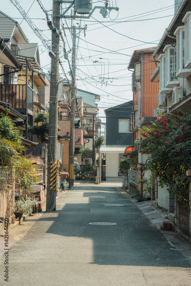 Alley residential in japanese neighborhood with traditional houses, bicycle, car in suburban Alley residential in japanese neighborhood with traditional houses, bicycle, car in suburban