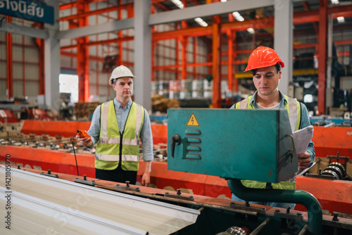 Wallpaper Mural Steel factory workers inspect sheet metal materials, ensuring industrial manufacturing quality, precision, material processing, heavy machinery operation, workflow safety, structural production Torontodigital.ca