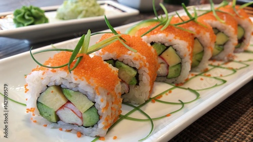 Sushi Rolls Topped with Fish Roe and Avocado Garnishes