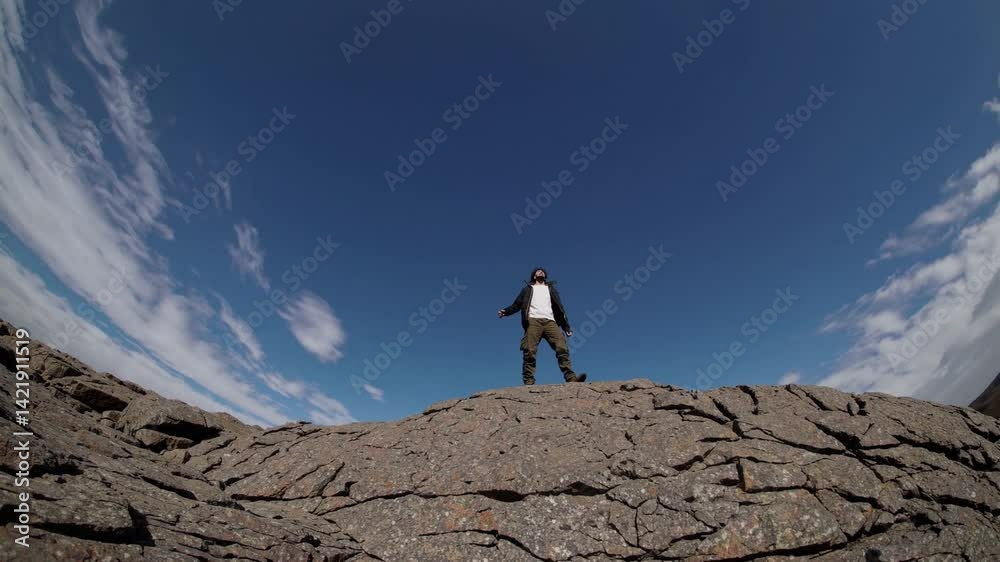 silhouette of a man standing on a rock silhouette of a man standing on a rock