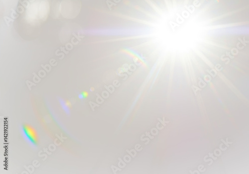 A brilliant lens flare with starburst effect radiate, subtle rainbow refractions on transparent background