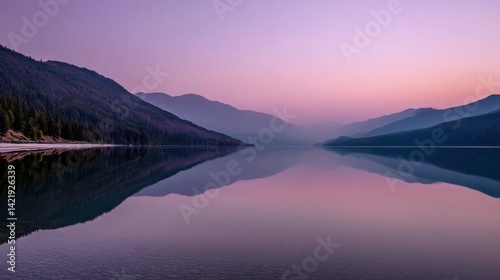 Serene lake at twilight reflecting distant mountains and soft pastel sky, perfect mirror effect