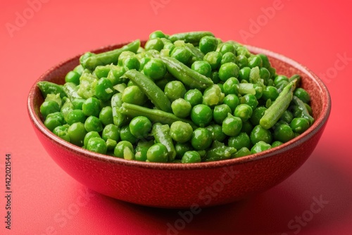 Sauteed peas and green beans in bowl