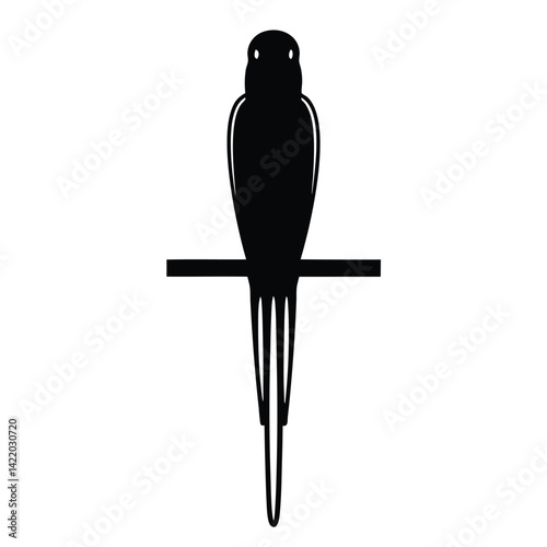  A parrot silhouette perched on a branch,