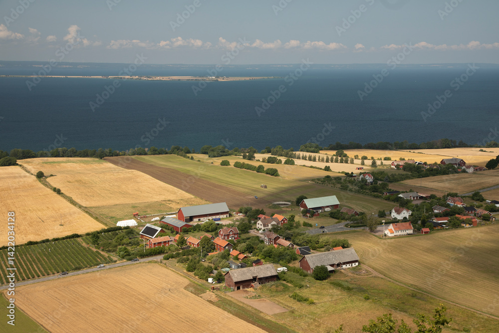 Obraz premium View of the village and the lake shore from the top of the hill