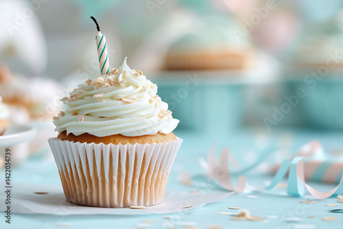 A single vanilla cupcake with smooth white frosting sits centered against a soft pastel background, such as pale peach or dusty blue
