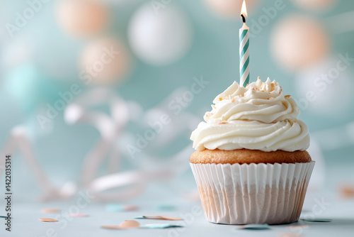 A single vanilla cupcake with smooth white frosting sits centered against a soft pastel background, such as pale peach or dusty blue